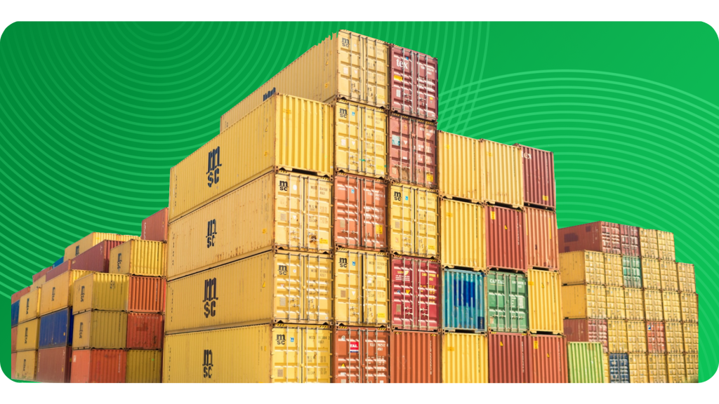 Stacks of shipping containers rest on a platform.