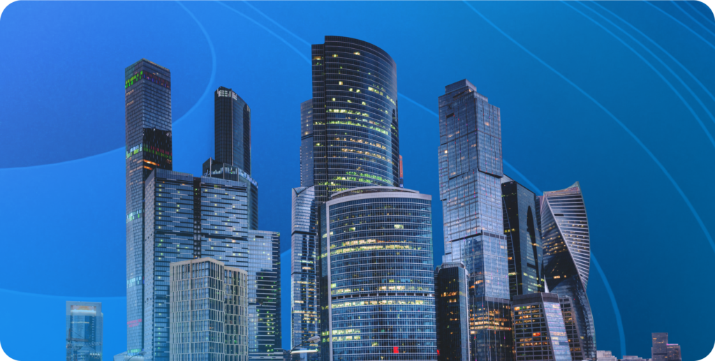A set of city skyscrapers in front of a blue background.